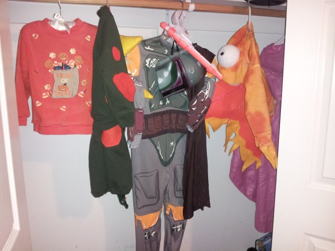 Boba Fett hanging with costumes of years past in Noah's closet (staged. He's EIGHT. No eight year old has a tidy closet with only Halloween costumes in it.)